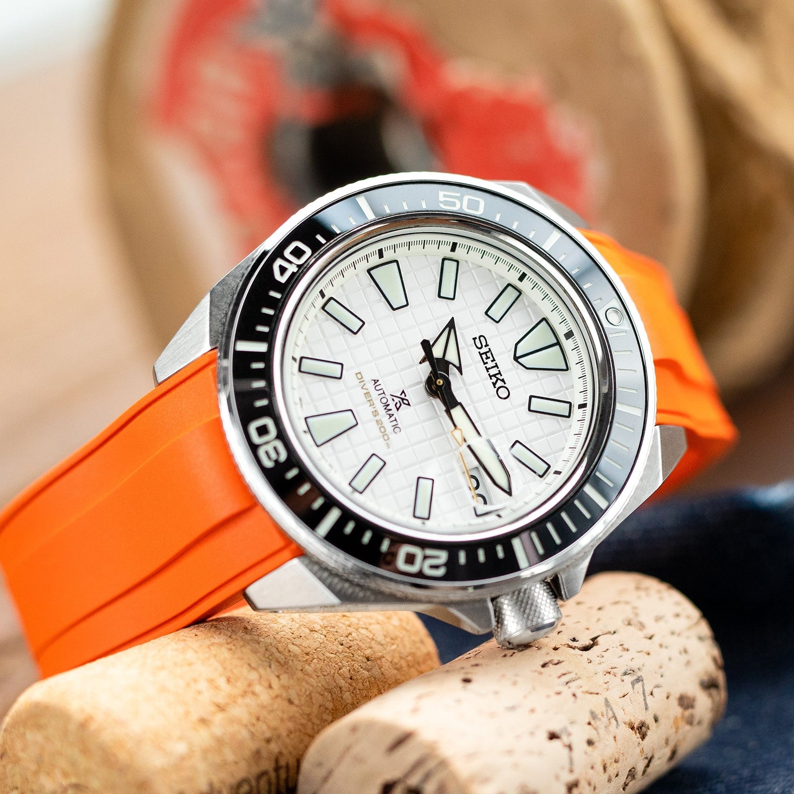 A Watch with an orange watch band