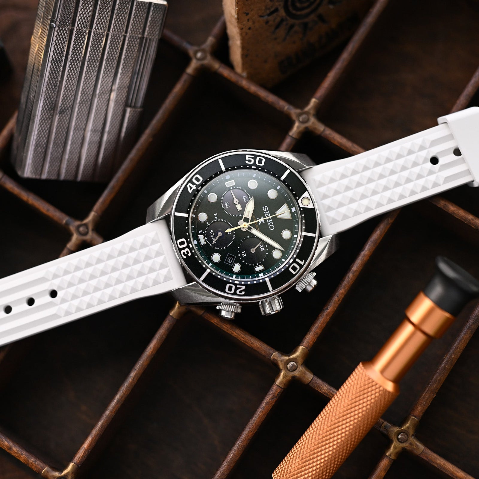 A watch with a white watch band